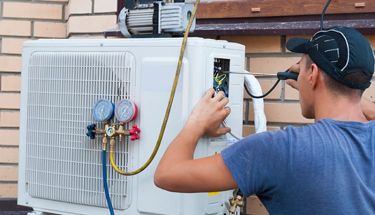 The,Worker,Installs,The,Outdoor,Unit,Of,The,Air,Conditioner